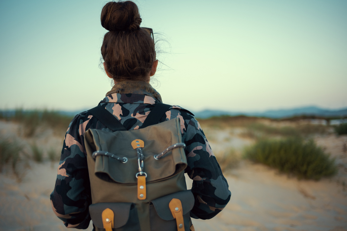 adventure traveller woman in hiking gear outdoors